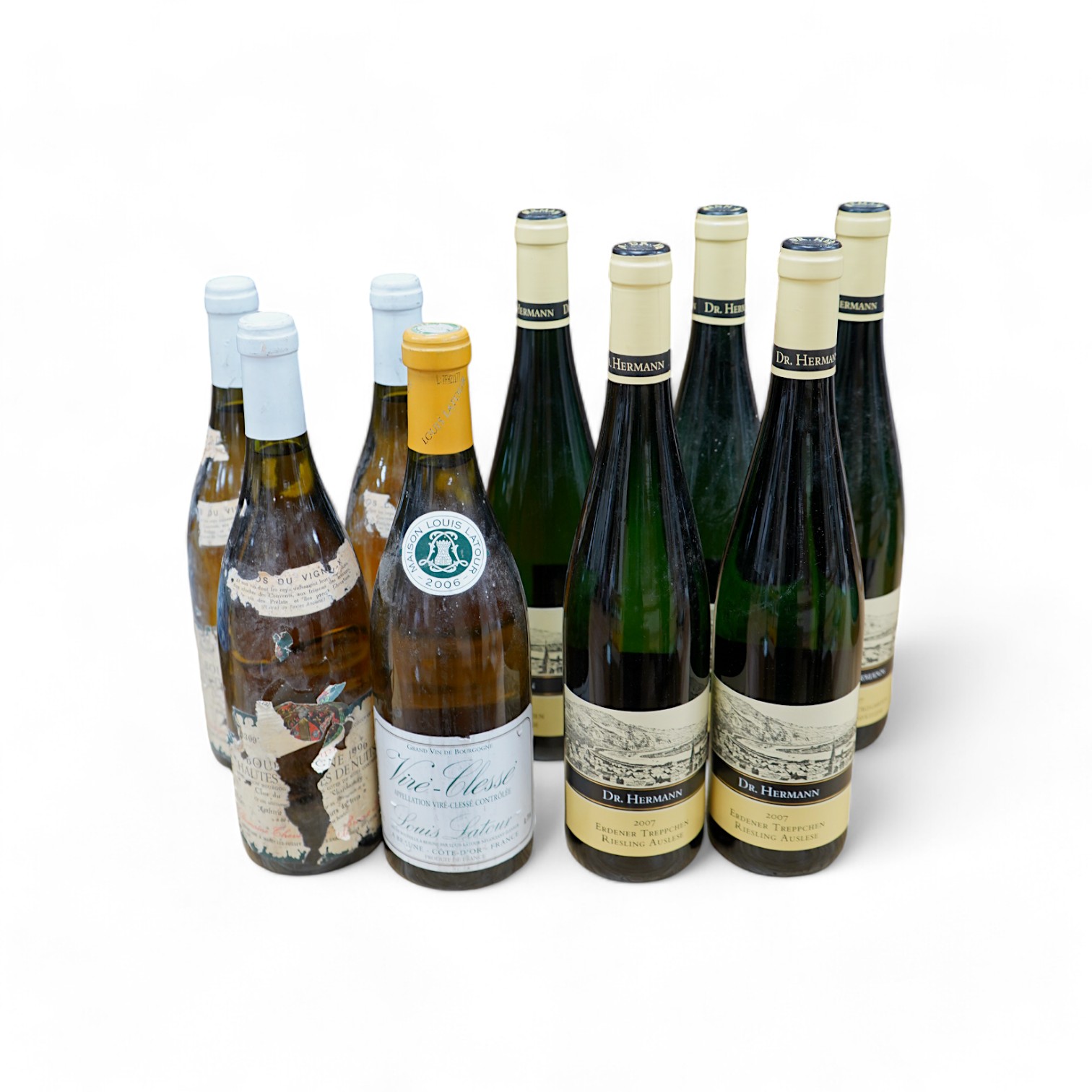 Nine bottles of white wine including; Five bottles of Dr. Hermann 2007 Erdener Treppchen Riesling Auslese, a bottle of Vire-Clesse Louis Latour, and three bottles of 1996 wine (labels badly damaged). Condition - poor to